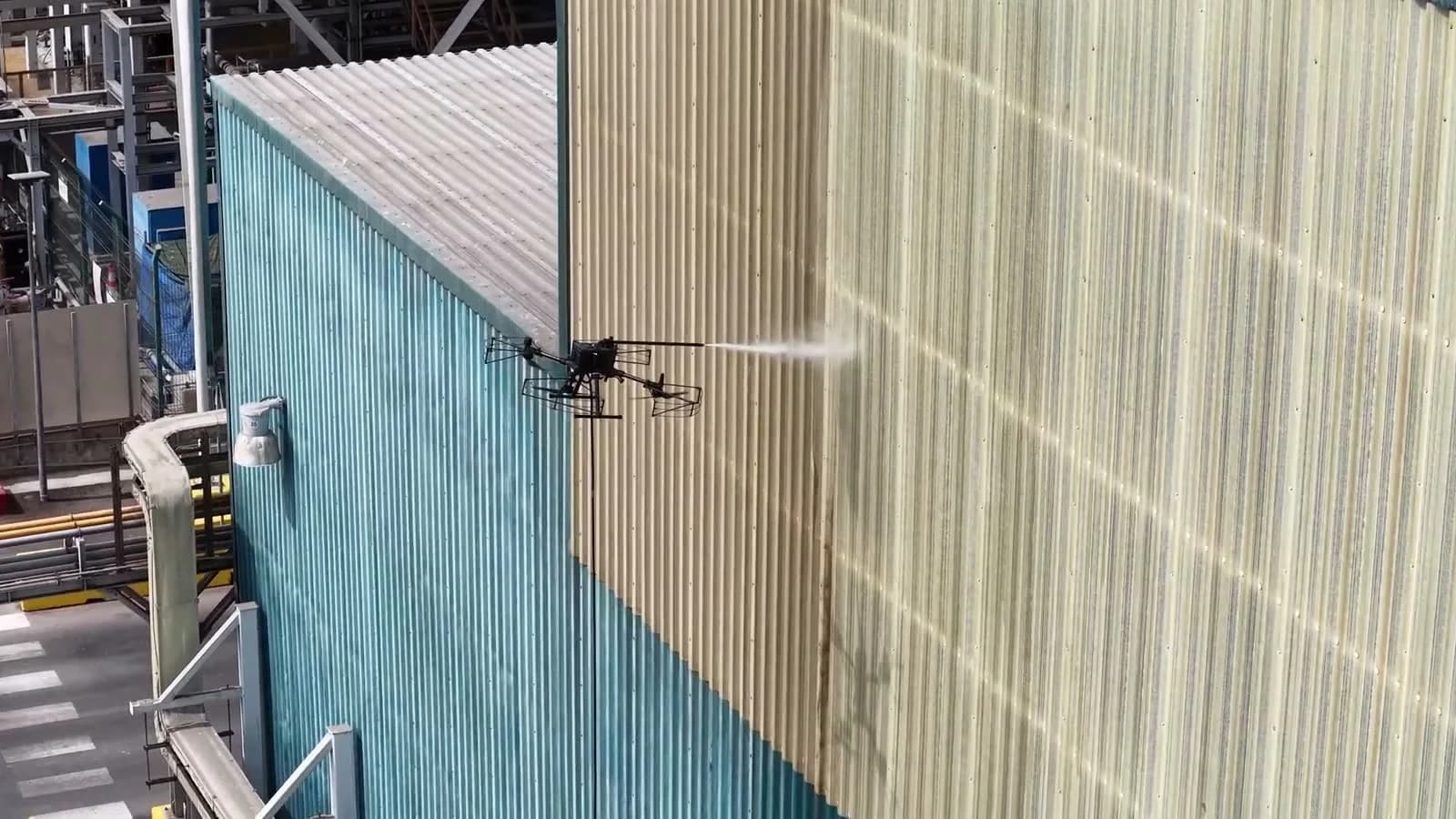Façade of a mining facility during drone cleaning